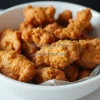 A bowl of golden crispy fried chicken