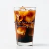 A cold brew coffee with ice swirling inside