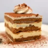 A decadent tiramisu dusted with cocoa