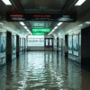 A flooded subway entrance with climate change warning posters on the walls documentary style