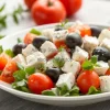 A Greek salad with olives
