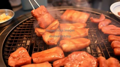 A Korean BBQ grill with sizzling meats