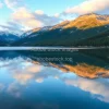 A lake reflecting mountains like a mirror