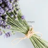 A lavender bouquet tied with natural twine