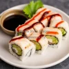 A plate of sushi rolls with soy sauce