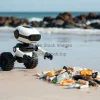 A robot cleaning up plastic waste on a beach