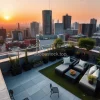 A rooftop garden oasis in the middle of a concrete megacity evening golden hour