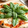 A rustic pizza topped with fresh basil leaves