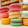A stack of colorful macarons in a pastry shop