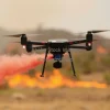 A wildfire being controlled by eco-friendly firefighting drones