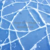 Abstract geometric ice patterns on frozen surface