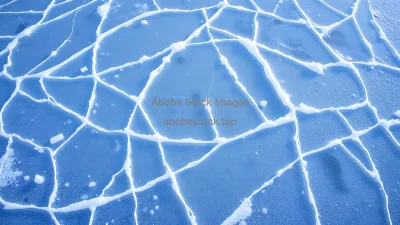 Abstract geometric ice patterns on frozen surface