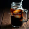 Black iced coffee in glass jar with large ice cubes