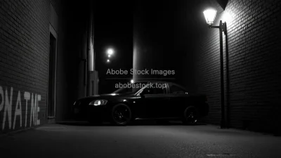 Car parked in a narrow alley lit only by a single streetlamp noir style
