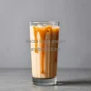 Caramel iced latte with caramel drizzle inside glass