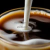Cascading milk being poured into cold brew