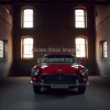 Classic car inside an old brick warehouse shafts of light from windows