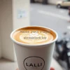 Classic latte in paper cup with minimalist branding