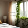 Contemporary bedroom with ivy climbing around the window frame