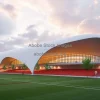 Contemporary sports complex with asymmetric roof
