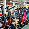 Electric scooter assembly line with colorful frames wheels and batteries being integrated urban mobility theme