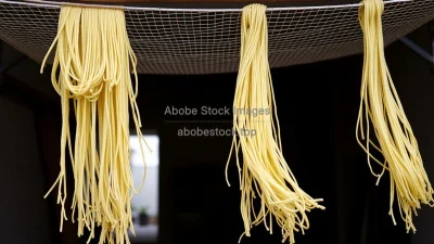 Freshly made pasta hanging to dry