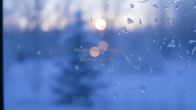Frost-covered window with blurred light behind