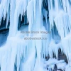 Frozen waterfall details with blue and white tones