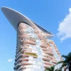 Futuristic mixed-use tower with aerodynamic top