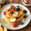 Healthy banana pancakes with honey and berries on a plate