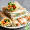 Healthy fresh spring rolls with vegetables and herbs on a plate