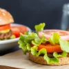 Healthy plant based burger with whole grain bun lettuce and tomato