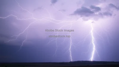 High energy lightning strike with clearly visible electric field lines over a stormy landscape