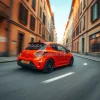 Hot hatchback racing through narrow European backstreets motion and blur