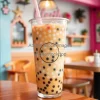 Iced coffee with boba pearls in tall plastic cup