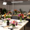 Indoor flower arrangement class setup with tools