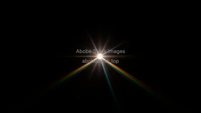 Laser beam passing through prism dispersing into rainbow spectrum dark background high contrast