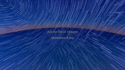 Long exposure star trails curving around celestial pole demonstrating Earth rotation astrophotography