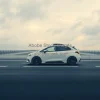 Minimalist white autonomous car on an empty futuristic highway cloudy sky