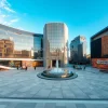Modern civic plaza surrounded by sleek structures