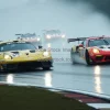 Racing cars on a rainy track water spray reflections dramatic competitiveness