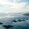 Solar panels floating on a calm reservoir mountains in background high realism