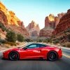 Sports car speeding through a canyon road red rock cliffs on both sides